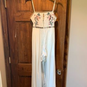 White romper with long skirt in back